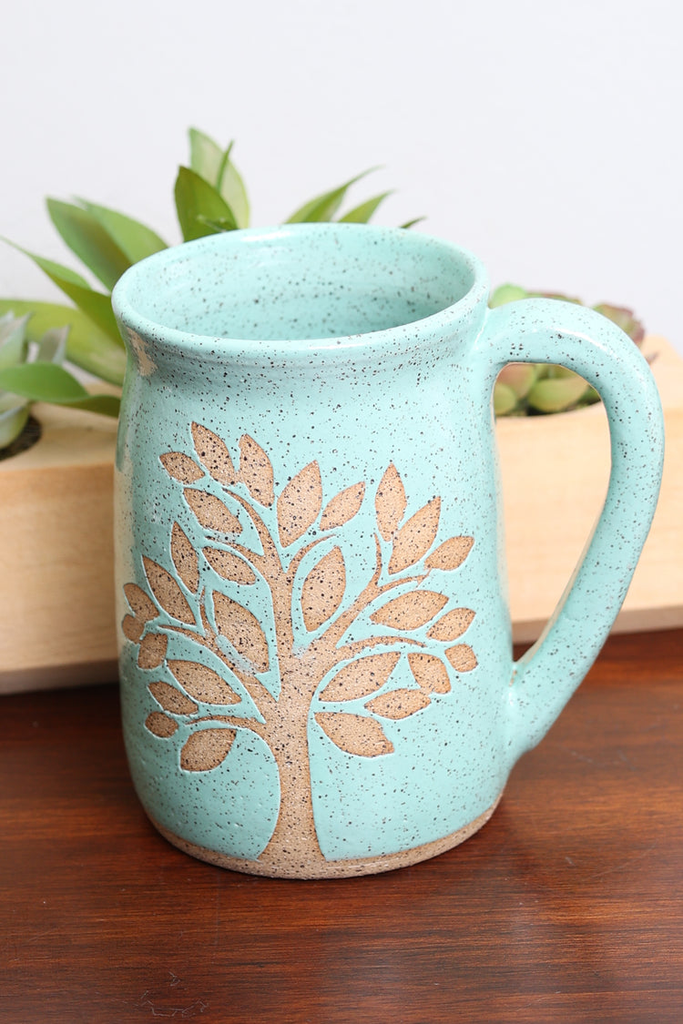 Handmade stoneware mug with nature-inspired design