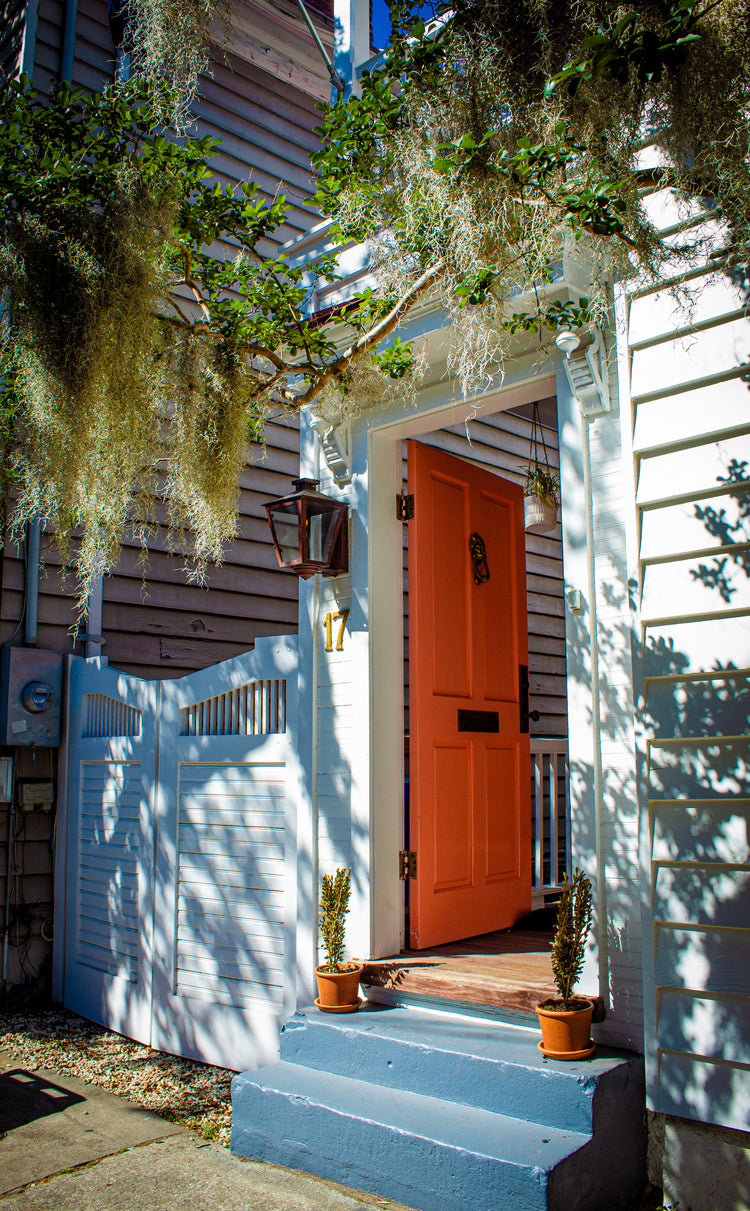 Fine art photograph titled “Charleston Orange Door” by Amy Bishop
