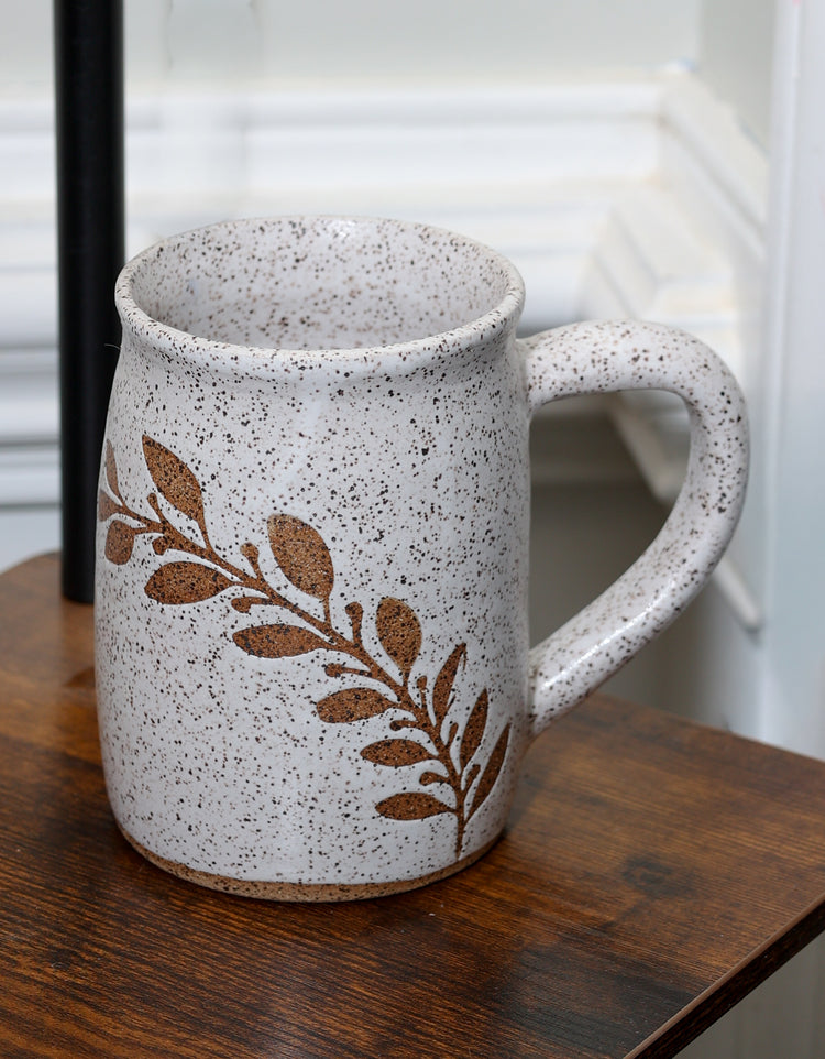 Handmade stoneware mug with nature-inspired design