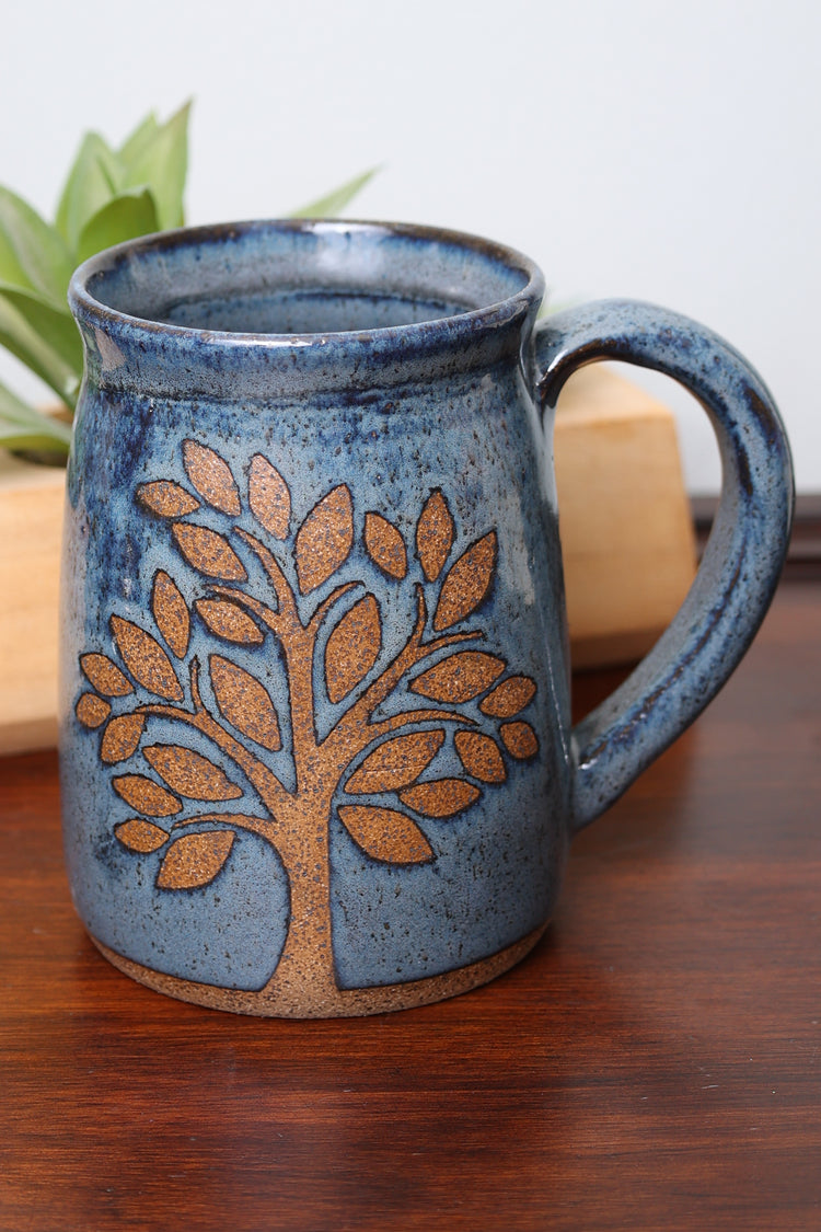 Handmade stoneware mug with nature-inspired design