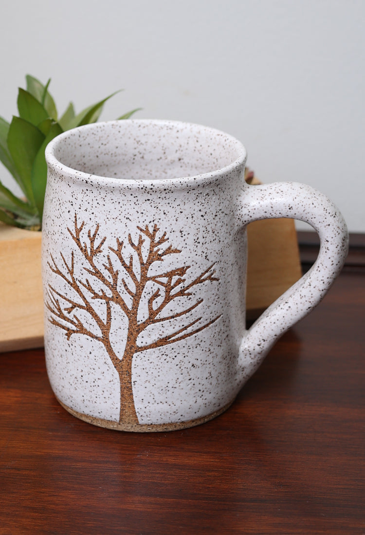 Handmade stoneware mug with nature-inspired design